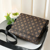 A brown leather men's casual crossbody bag with an easy flap design resting on a white surface.