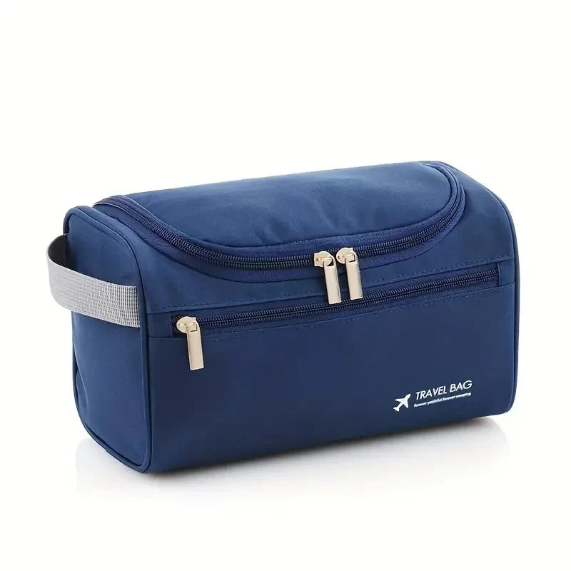 A navy blue durable hanging leather toiletry bag with silver zippers and a gray strap.