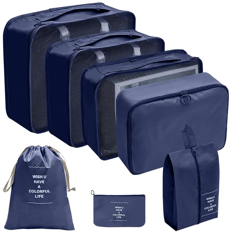 A set of navy blue fabric storage organizers and a matching drawstring pouch.