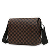 A brown plaid crossbody shoulder bag with black trim and strap shown against a white background.