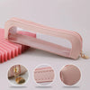 A pink portable transparent cosmetic organizer pouch with a gold charm, shown from the side and close-ups of details.