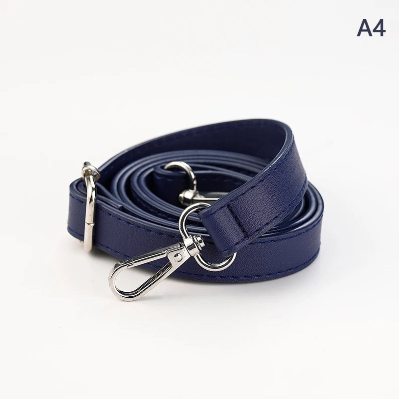A dark navy blue PU leather strap with a silver clasp and lobster claw buckle rolled up.