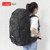 A large black travel backpack with a rain cover is shown being held by a person.