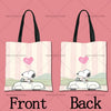 A pink canvas tote bag featuring a cartoon drawing of Snoopy on the front and back.
