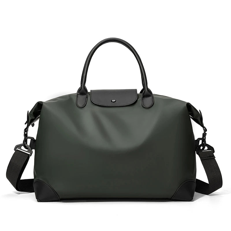 A dark gray durable nylon travel duffle bag with black leather accents and a top handle.