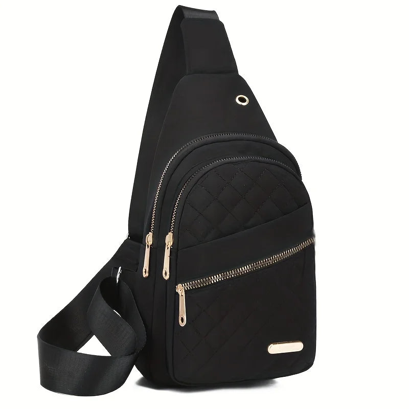 Black quilted crossbody sling bag with gold hardware shown from the side.