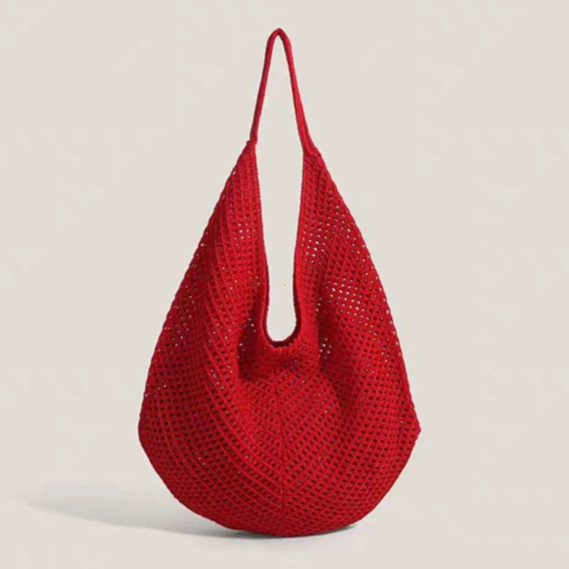 A bright red women's crochet shoulder bag with mesh detailing shown against a light background.