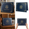 A dark blue elegant birth certificate holder with gold accents displayed on a wooden surface.
