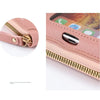 A close-up view of a pink leather crossbody cell phone bag with a gold zipper and a smartphone inserted.