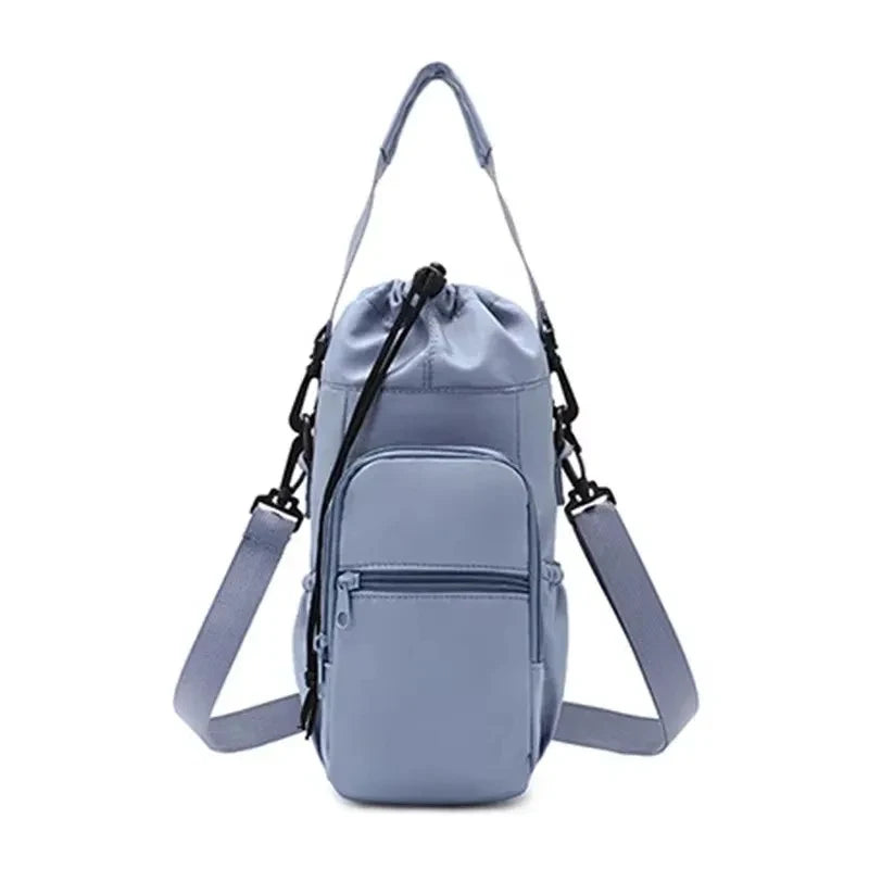 A light blue adjustable strap thermal water bottle bag with a separate pocket and shoulder straps.