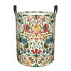 A vintage floral laundry hamper with a patterned fabric and black handles.