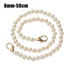 A strand of 8mm-50cm pearl beads used as a strap for a handbag or purse.