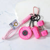 Pink fitness dumbbell keychain charm with black chain and pink strap