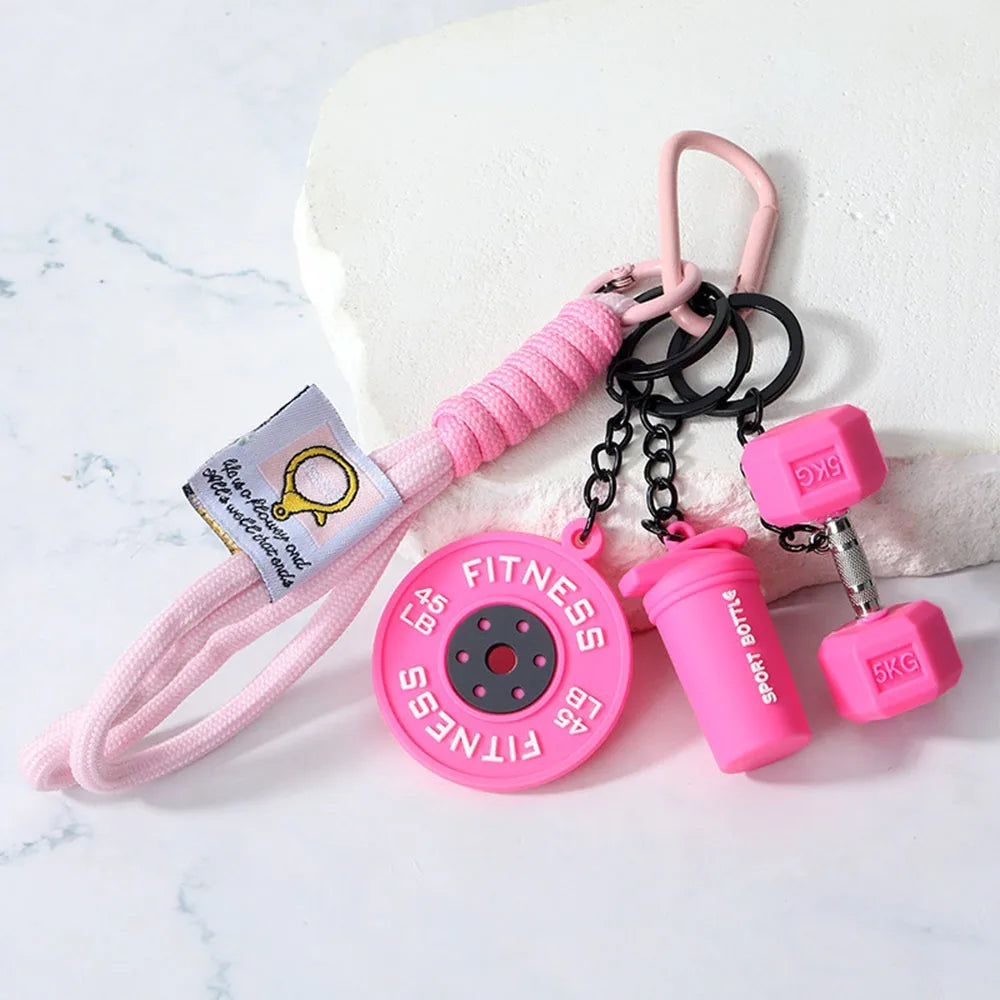Pink fitness dumbbell keychain charm with black chain and pink strap