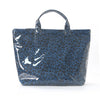 A dark blue leopard print tote bag with a handle, shown against a white background.