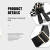 A woman is shown wearing a black and white checkered crossbody bag with a gold buckle and adjustable strap.