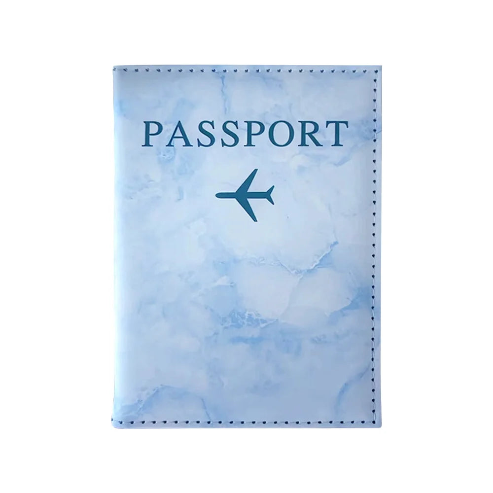 A light blue passport card holder with a faint marbled texture and a dark blue airplane silhouette.