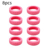 Eight pink silicone luggage wheel protection rings.