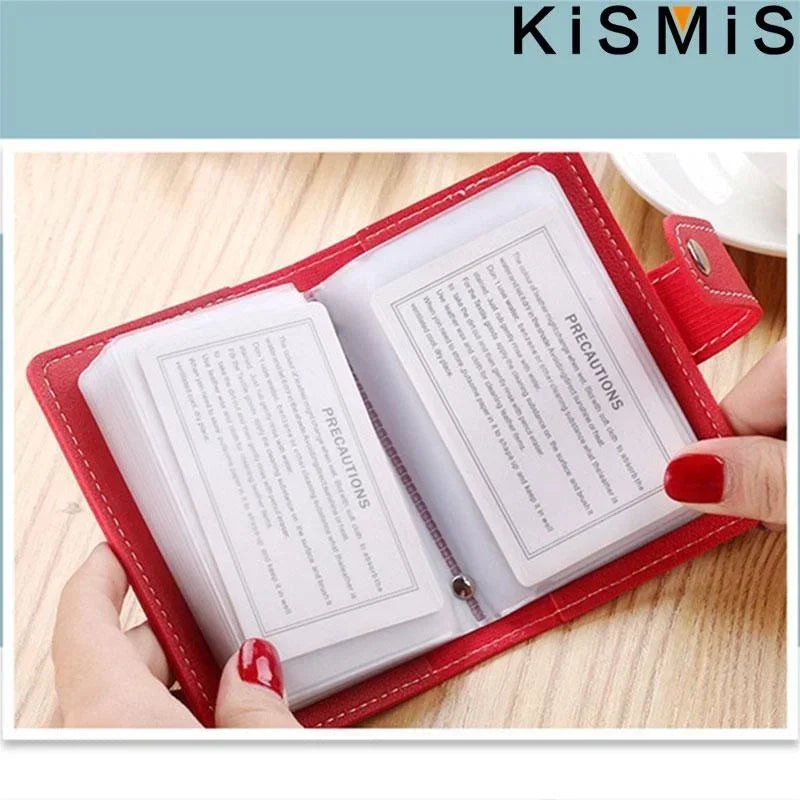 A red leather card holder with a clear plastic sleeve displaying precautions inside.