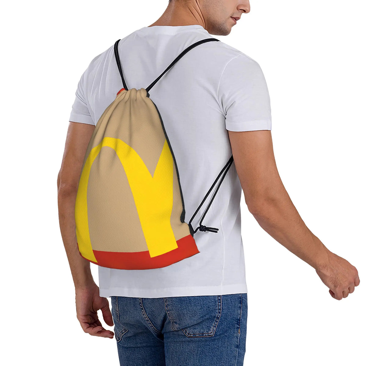 A person wearing a white t-shirt with a yellow and orange kraft paper drawstring bag slung over their shoulder.