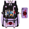 Schwarze und lila Leinenschulrucksack-Set mit Hello Monsters-Grafiken und rosa Akzenten.
