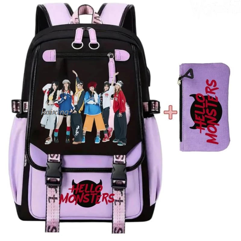 Schwarze und lila Leinenschulrucksack-Set mit Hello Monsters-Grafiken und rosa Akzenten.