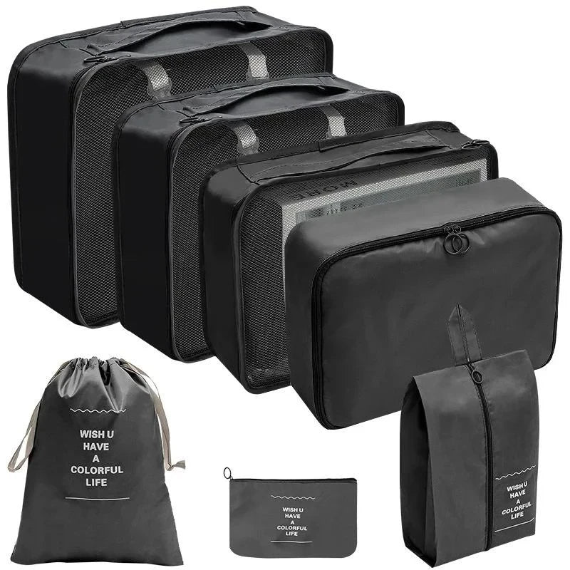 A set of black fabric storage organizers and a drawstring bag for organizing items.