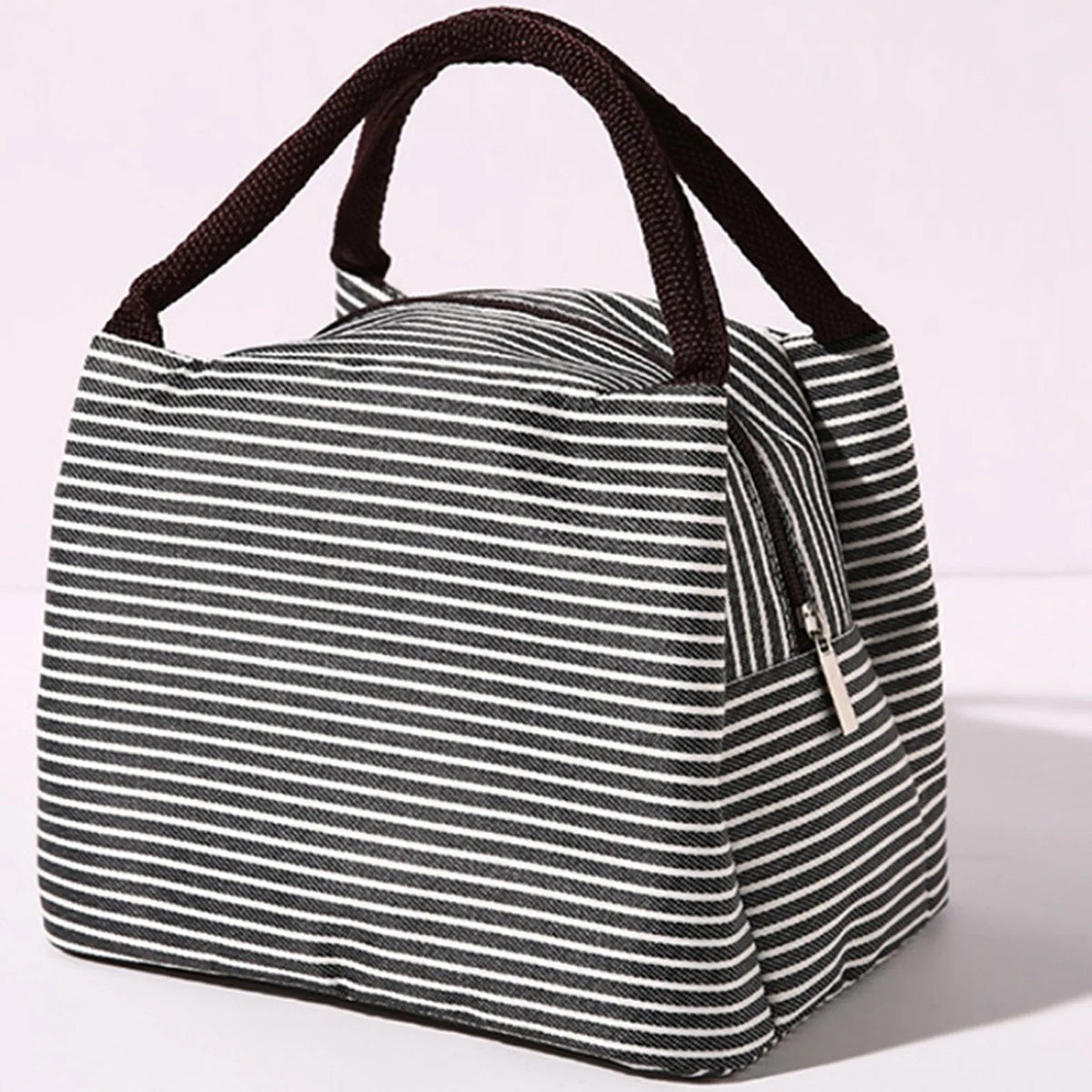 A black and white striped insulated lunch tote bag with a dark brown adjustable shoulder strap.