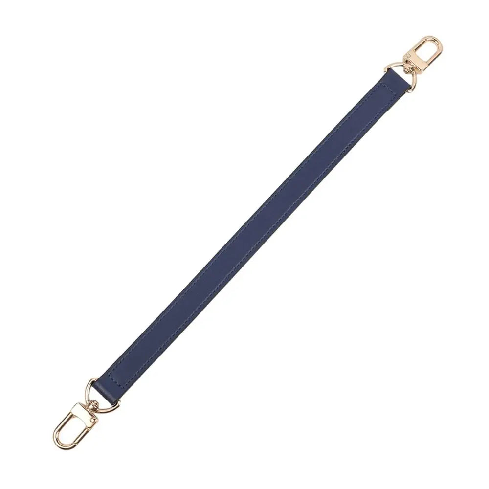 A navy blue genuine leather replacement shoulder strap with gold-toned hardware.