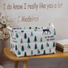 A white fabric storage basket with a green and purple pine tree pattern sits on a wooden shelf.