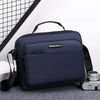 A navy blue professional waterproof business briefcase with a black handle and strap is shown on a gray surface.