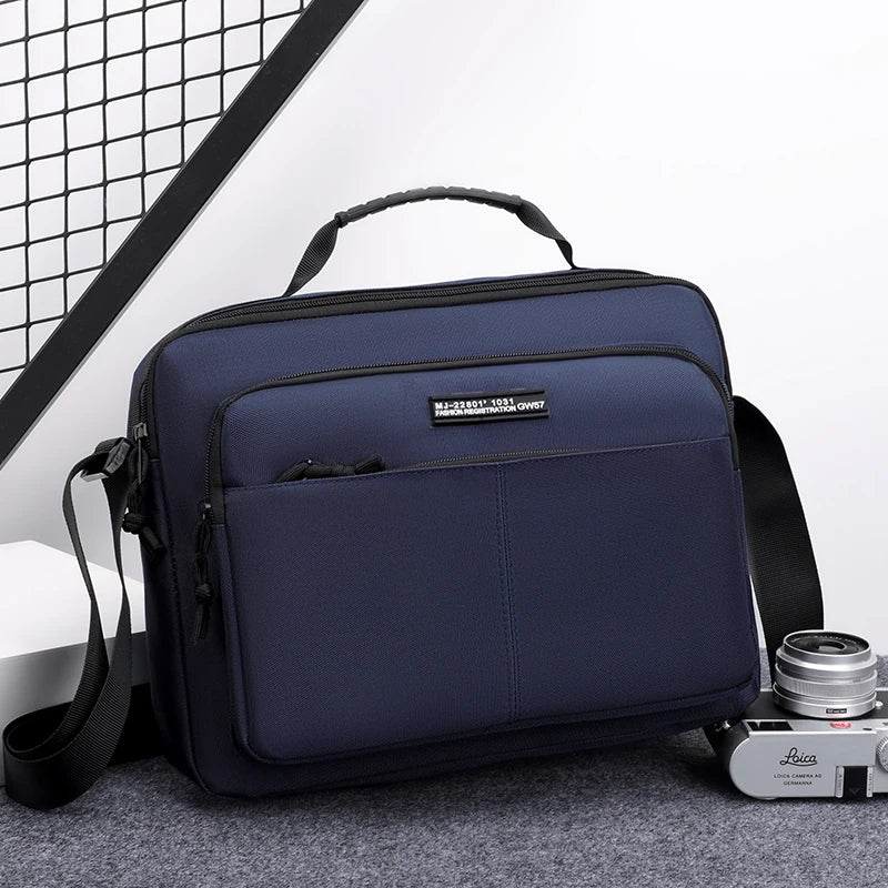 A navy blue professional waterproof business briefcase with a black handle and strap is shown on a gray surface.