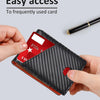 A hand holds a black bifold wallet with a red card inserted, demonstrating easy access.