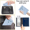 A black leather passport card holder with a blue letter print passport card and a blue passport.