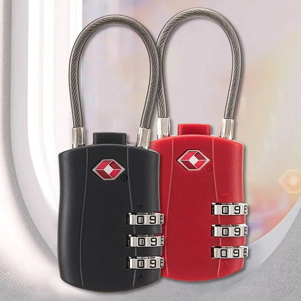 A pair of black and red TSA-approved combination cable locks with silver clasps and braided handles.
