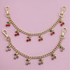 Gold decorative chain with small red and green gemstone pendants for bags and clothing