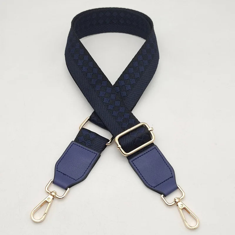 A dark blue braided nylon bag strap with gold-toned metal hooks.