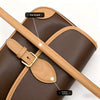 A brown leather shoulder strap is shown attached to a dark brown bag, highlighting the original version.