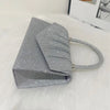 Silver glitter fabric foldable crossbody evening bag with a silver chain strap