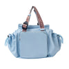 Light blue nylon shoulder bag with patterned strap and flap