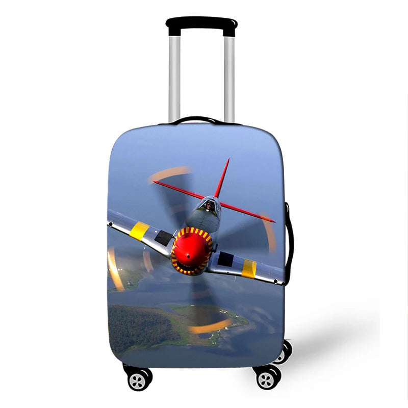 A silver suitcase with a graphic design of an airplane in flight on the cover.