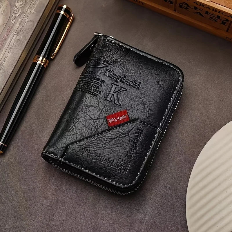 A black vintage PU leather slim wallet with an embossed K and a leather pen resting on a dark surface.
