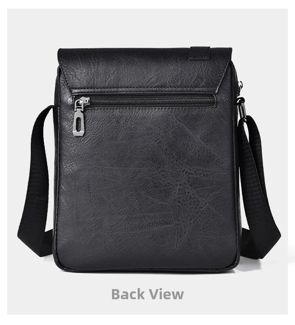 Back view of a black PU leather messenger bag with a zippered compartment and adjustable strap.