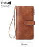 A brown leather trifold clutch wallet with a protective RFID shield.