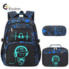 A black and blue graffiti-themed backpack with matching accessories, including a laptop sleeve and a protective case.