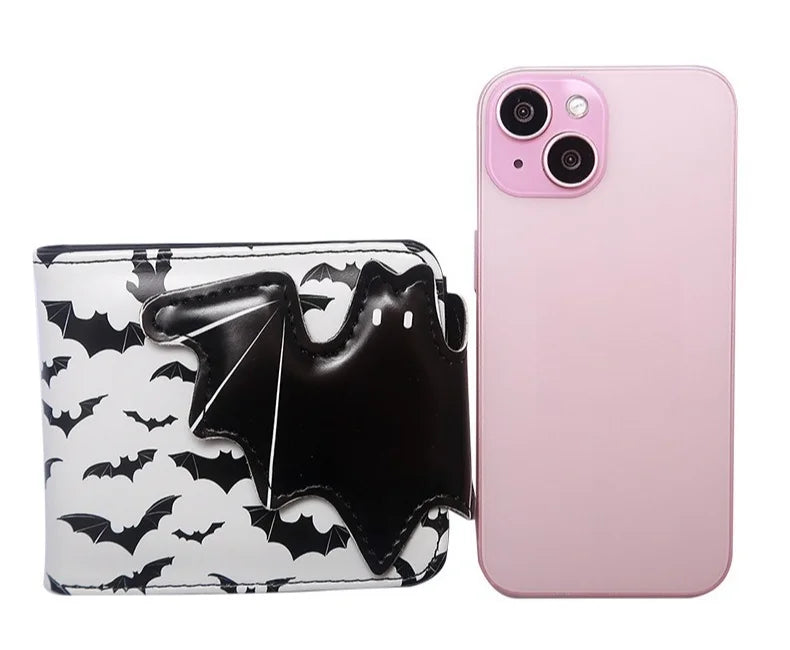 A pink smartphone is shown next to a black bat print PU leather wallet.