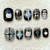 A set of press-on nails featuring cute cartoon animal designs like a cat and a fish on a white background.