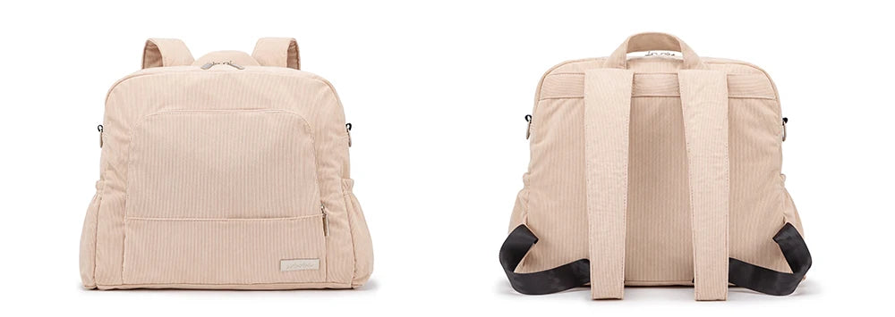A light beige soft corduroy diaper backpack shown from the back.