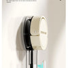 A close-up of a beige suction hook with a 90 degree angle, demonstrating how to hang securely on a smooth surface.