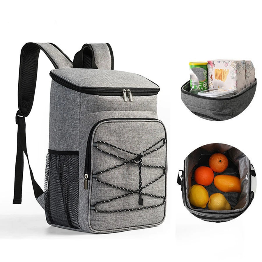 Gray insulated lunch backpack with a waterproof shell and an accessory tray containing fruit.